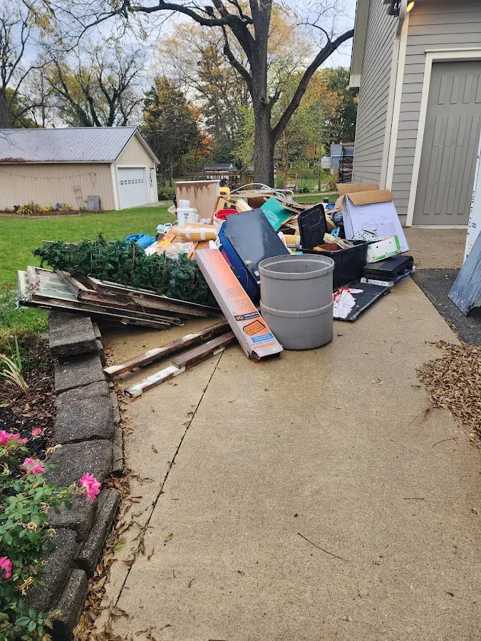 Dumpster being loaded with debris for 30 Yard Dumpster Rental in Littlefield
